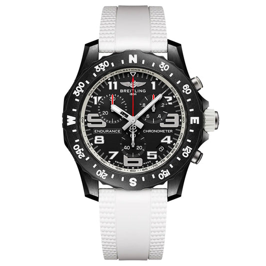 The Breitling Endurance Pro 44 is a black athleisure watch with a white textured strap, Breitlight® bezel, black dial with white numerals, three subdials, and bold red and white hands.