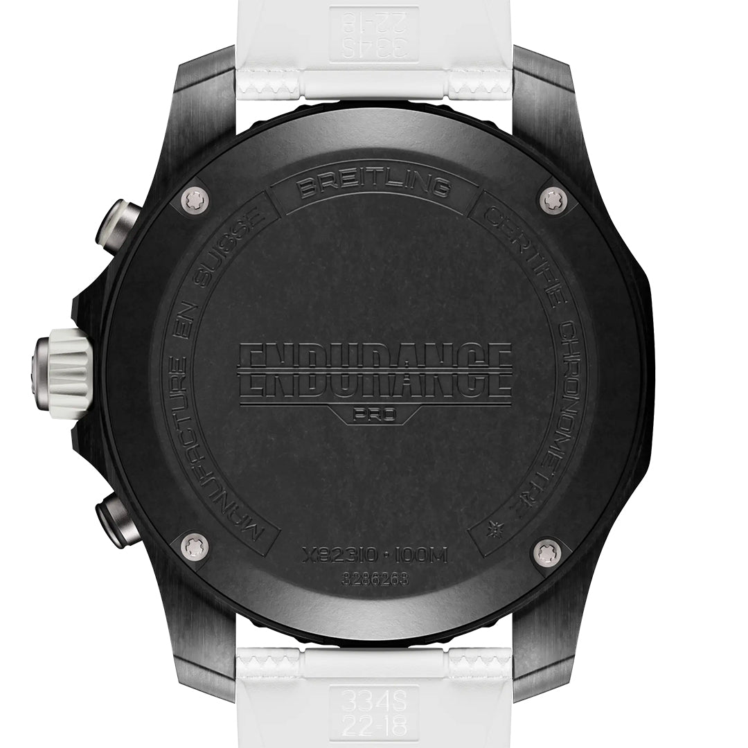 The back of the BREITLING Endurance Pro 44 showcases engraved text—“ENDURANCE,” “Breitling,” and water resistance info—on its tough Breitlight® case, while a stylish white strap enhances its sporty look.