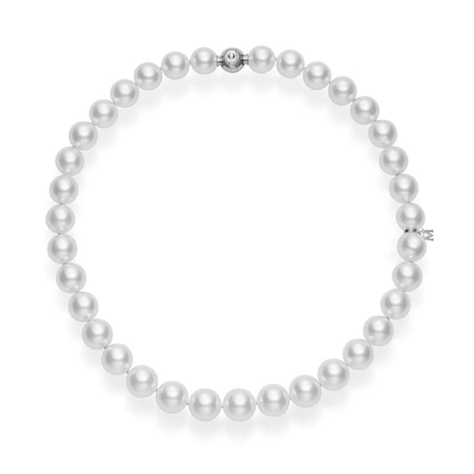 The Mikimoto South Sea Pearl Strand Necklace showcases a luxurious design, featuring evenly sized, lustrous white pearls and an 18K white gold clasp, elegantly arranged in a circular shape against a plain white background.