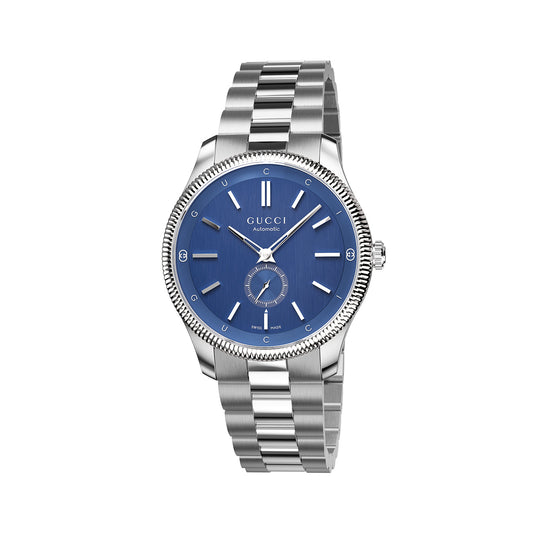 The Gucci G-Timeless Automatic 40mm Watch by GUCCI Watch features a chic, modern design with a blue dial and silver hour markers. Its sophisticated silver steel bracelet enhances the sleek aesthetic, which includes a small date window and a second dial at the six o'clock position.