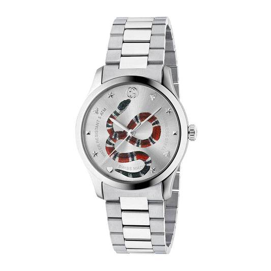 This GUCCI watch, the G-Timeless Quartz 38mm, showcases a silver metal wristwatch with a unique dial design featuring a detailed snake on the face and star hour markers. Its bracelet, reflecting traditional sensibility, is crafted in matching silver.