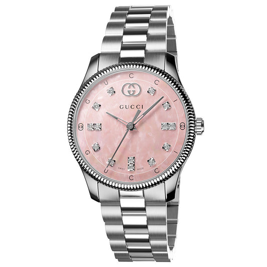 The Gucci G-Timeless Quartz 29mm Watch features a silver metal link band, pink mother-of-pearl dial, diamond hour markers, and the GUCCI logo at the top.