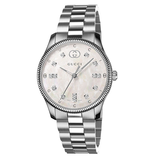 The GUCCI G-Timeless Quartz 29mm Watch features a silver metal link band, mother-of-pearl dial with diamond indexes, Gucci logo at 12 o'clock, and a textured bezel for a sleek, elegant look.