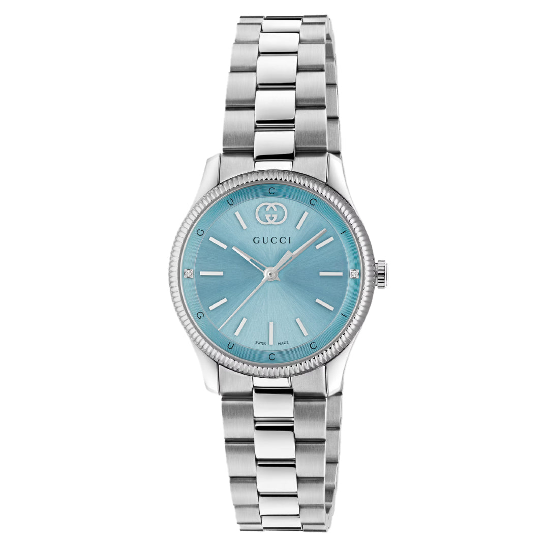 The Gucci G-Timeless Quartz 29mm Watch features a stainless steel bracelet, light blue face, silver hour markers and hands, the Gucci logo, and reliable quartz movement.