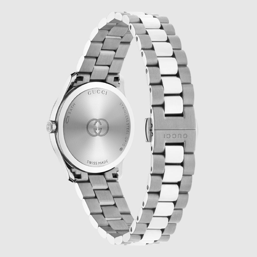 The GUCCI Watch G-Timeless Quartz 29mm features a stainless steel bracelet with alternating silver and white links and a case back engraved with the Gucci logo and "Swiss Made," powered by precise quartz movement.