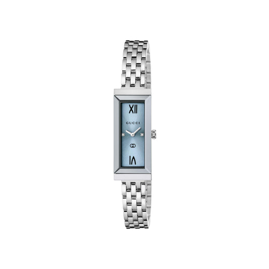 The Gucci G-Frame Quartz 14mm x 34mm Watch features a slim rectangular blue face with Roman numerals at 12 and 6, minimalist hands, Swiss Made mark, and a stainless steel bracelet bearing the GUCCI logo.
