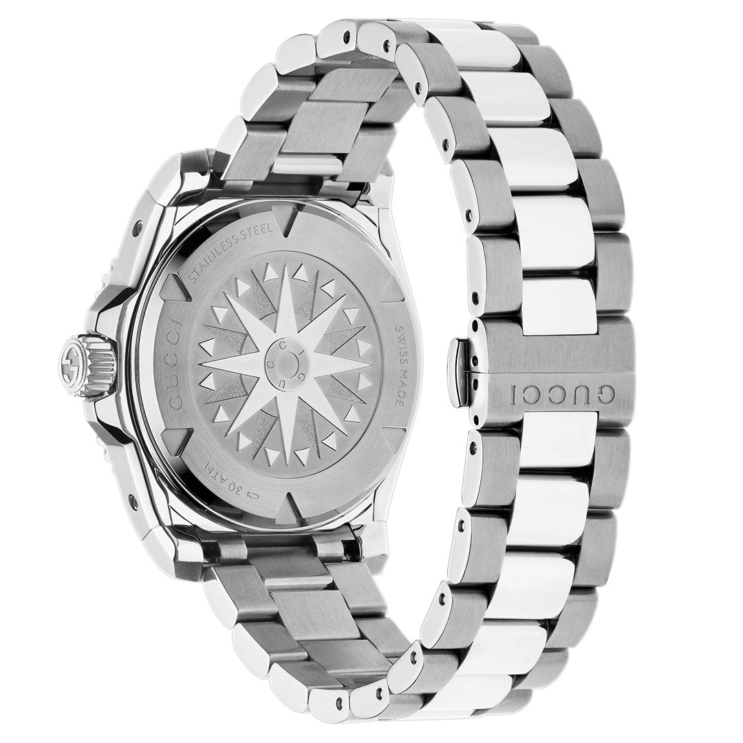 A close-up of the back of the Gucci Dive Automatic 40mm Watch shows its stainless steel band, engraved starburst design, Interlocking G logo, and inscriptions: "GUCCI," "STAINLESS STEEL," and "SWISS MADE.