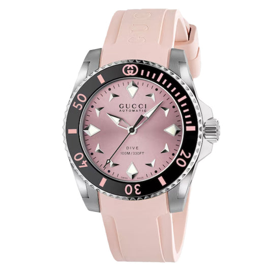 The Gucci Dive Automatic 36mm Watch by GUCCI features an automatic movement, pink dial with matching rubber strap, silver and black bezel, silver markers, and "Gucci Automatic Dive 100M/330FT" on the dial.