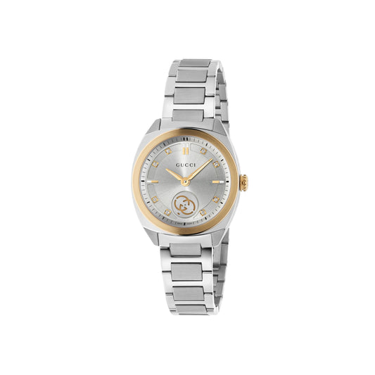The GUCCI Interlocking Quartz 29mm Watch features a silver metal link band, pink gold-plated bezel and crown, grey face with diamond indexes, gold hands, and Gucci logos at 12 and 6 o’clock, shown on a white background.