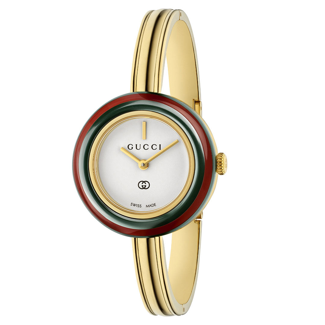 The GUCCI Play Quartz 28mm Watch features a yellow gold-plated case, round white dial, minimalist gold hands, and a bezel with green and red stripes. Its sleek bracelet band completes the modern design with precise quartz movement.