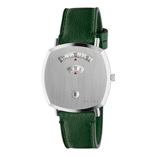 The Gucci Grip Quartz 38mm Watch by GUCCI features a brushed silver square dial with a distinctive analog display that reveals hours and minutes through small windows. This luxury timepiece is equipped with a stainless steel face and enhanced by a green textured leather strap. Additionally, it includes a circular date window for extra functionality.
