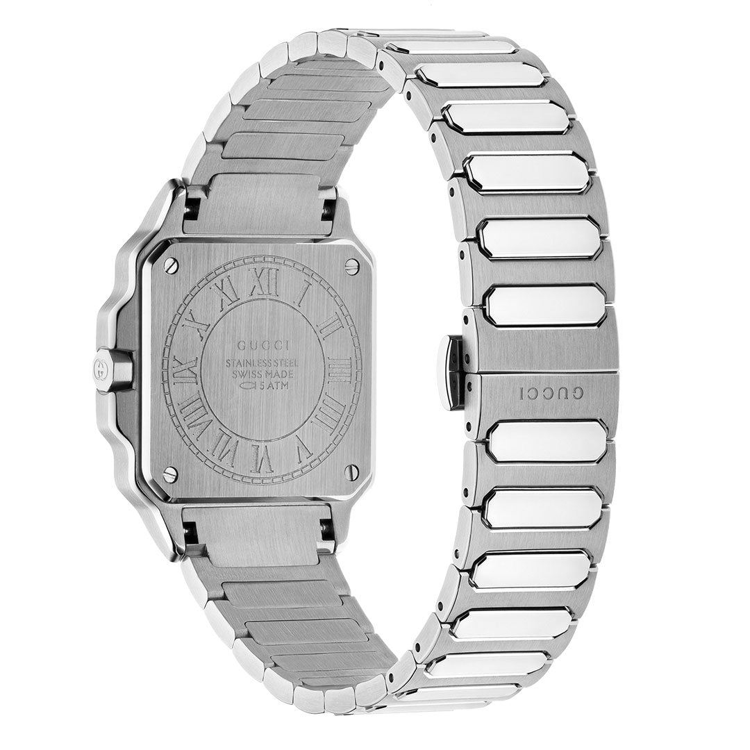 The back view of the Gucci G-Flat Quartz 30mm Watch showcases its engraved stainless steel case and "GUCCI" clasp, while the rectangular face with rounded edges features a sleek silver galvanized dial and link band.