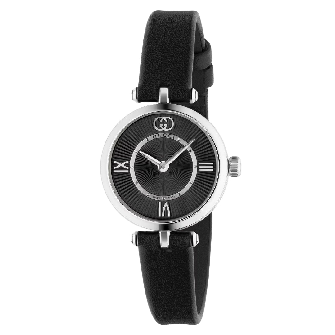 The Gucci Model 2000 Quartz 24mm Watch by GUCCI features a sleek design with a black leather strap, silver round case, and minimalist black dial. It showcases silver Roman numerals at 12, 3, 6, and 9 o'clock with silver hands and the logo at the top for an Italian style flair.