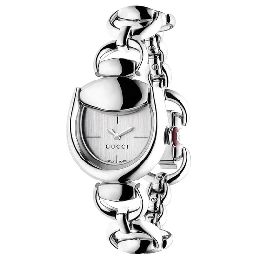 Featuring a distinctive chain-link bracelet, the Gucci Horsebit Quartz 27mm x 25mm Watch for women showcases an oval-shaped face with a minimalist design and the iconic GUCCI logo on the dial. Expertly crafted as a Swiss Made timepiece, this GUCCI Watch blends timeless elegance with signature style.