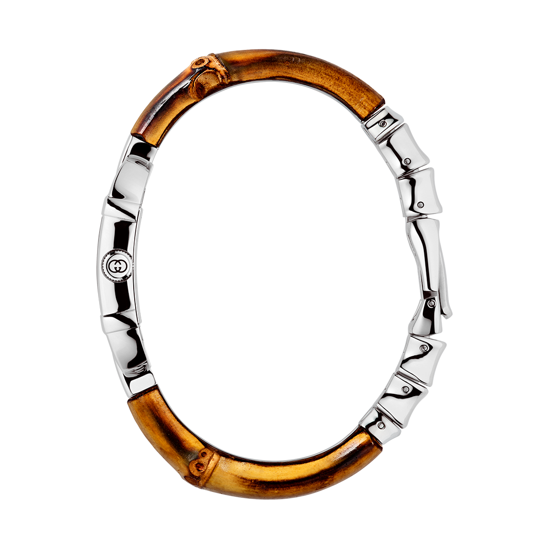 Gucci Bamboo Quartz 22mm x 17mm Watch with an oval-shaped, bamboo and silver-tone metal link bracelet and a small circular face featuring a central logo.