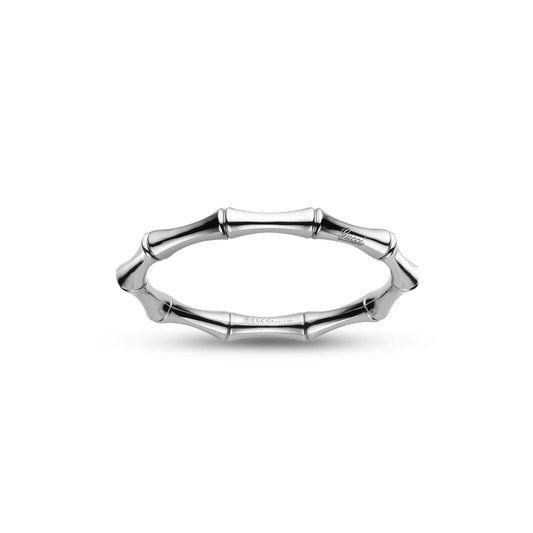 Introducing the Gucci Bamboo 18K White Gold Bangle by GUCCI Fine Jewellery—a sophisticated silver accessory with a polished finish. This bangle features cylindrical segments inspired by bamboo stalks, offering an elegant and timeless design.