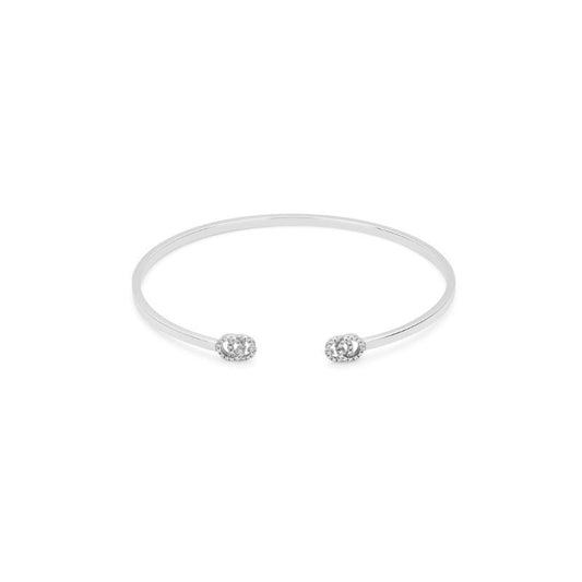 The Gucci Running G 18K White Gold Diamond Cuff Bracelet by GUCCI Fine Jewellery is a minimalist bracelet with an open design, featuring diamond-encrusted round details at each end against a white background.