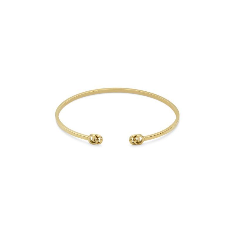 Introducing the Gucci Running G18K Rose Gold Cuff Bracelet by GUCCI Fine Jewellery, a minimalist piece boasting a smooth, round design with a small knot at each open end. Set against a plain white background, this bracelet embodies the elegance of the Gucci Love Parade collection.