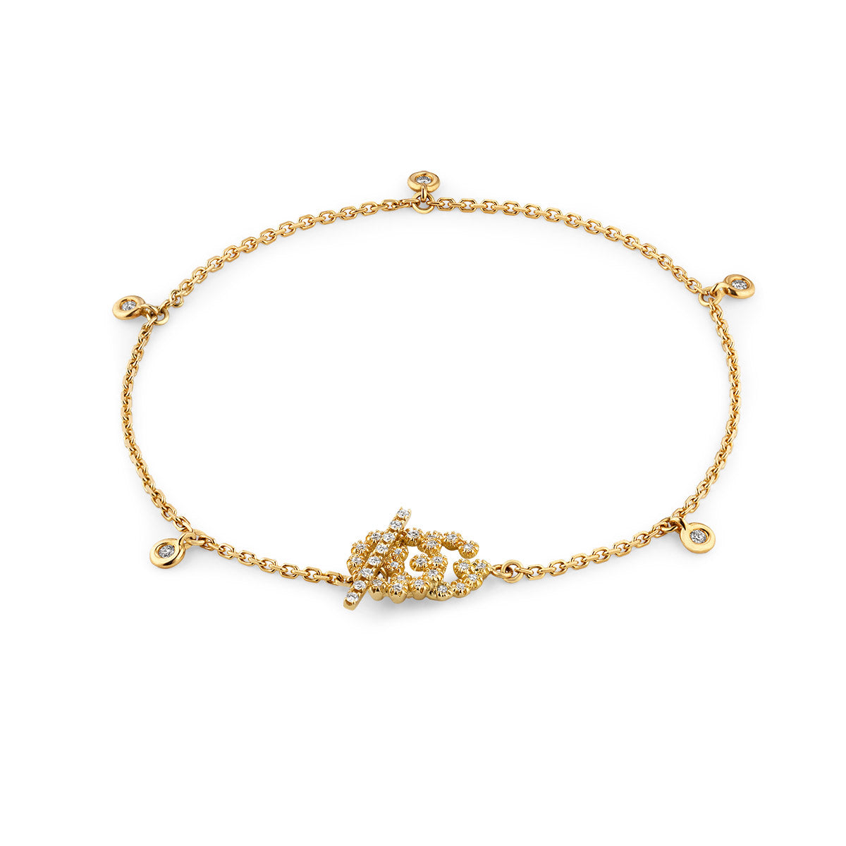 Introducing the GUCCI Fine Jewellery creation: the Gucci Running G 18K Yellow Gold Diamond Charm Bracelet. This exquisite bracelet features a delicate chain adorned with a central leaf design embellished with small diamonds, complemented by additional diamond charms evenly spaced along the chain for added elegance.