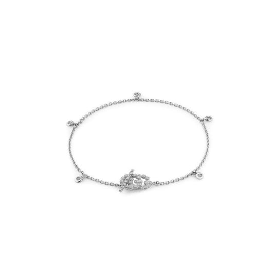 A luxurious piece from GUCCI Fine Jewellery, the Gucci Running G 18K White Gold Diamond Charm Bracelet is crafted with exquisite attention to detail. This delicate bracelet features a toggle clasp adorned with a charming diamond detail, along with small round embellishments that create an elegant arrangement reminiscent of diamond charms. The bracelet is beautifully showcased against a simple white backdrop.