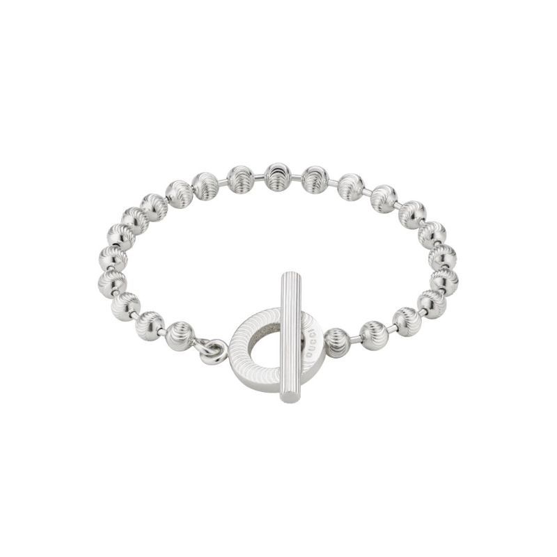 The Gucci Boule Sterling Silver Bead Bracelet by GUCCI Fine Jewellery features a textured toggle closure and uniformly spaced spherical beads, highlighted by a circular detail that enhances the clasp's allure. It is elegantly showcased against a clean white background.