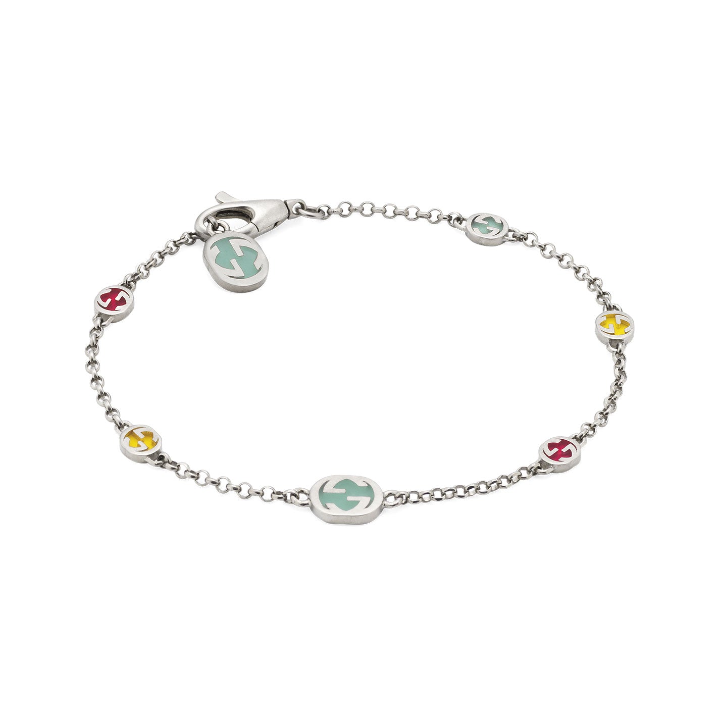 The Gucci Interlocking G Sterling Silver with Multicolour Enamel Station Bracelet by GUCCI Fine Jewellery is a delicate sterling silver piece featuring a lobster clasp and small oval charms in pastel blue, pink, and yellow. Each charm showcases a circular symbol design and is evenly spaced along the chain, exemplifying classic elegance with its multicoloured enamel accents.