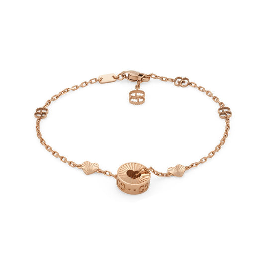 The Gucci Icon Heart 18K Rose Gold Station Bracelet from GUCCI Fine Jewellery showcases a delicate circular charm interwoven with small heart-shaped elements, exuding timeless elegance. It is finished with a secure lobster clasp closure, making it a stylish adornment for any occasion.