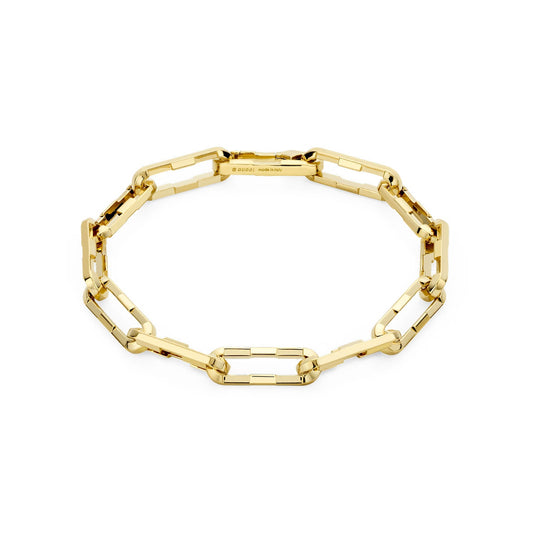 Presenting the Gucci Link to Love 18K Yellow Gold Wide Chain Bracelet by GUCCI Fine Jewellery, showcasing rectangular links in an elegant, closed-loop design. This exquisite piece embodies sophistication and stands out against a pristine white background, ideal for those who value timeless beauty and luxury.