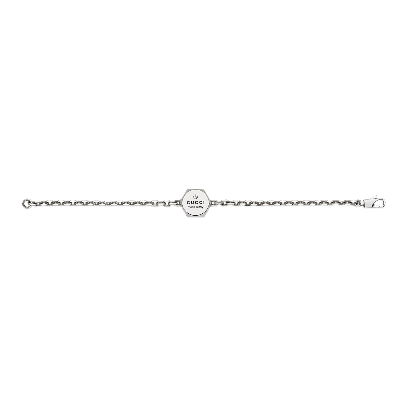 The Gucci Trademark Sterling Silver Bracelet from GUCCI Fine Jewellery boasts a sleek, minimalist design adorned with a small octagonal tag at the center, engraved with the iconic Gucci logo. This refined jewelry piece is elegantly finished with a lobster clasp.