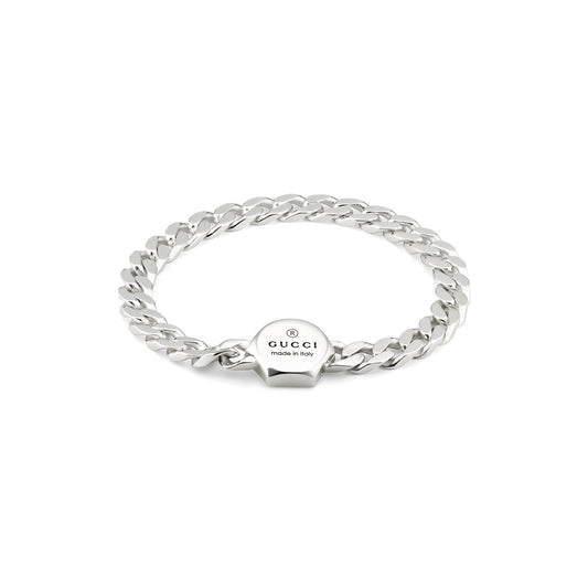 A Gucci Trademark Sterling Silver Bracelet by GUCCI Fine Jewellery, featuring a thick chain link design and a circular cassette closure engraved with "Gucci made in Italy" on a white background.