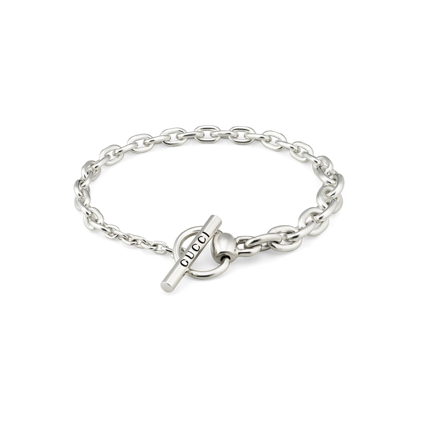 The Gucci Horsebit Chain Sterling Silver Bracelet from GUCCI Fine Jewellery is a simple and elegant piece, showcasing an engraved bar with the word "GUCCI" and a toggle closure. The design embraces an equestrian-inspired charm while highlighting the brand's iconic style.