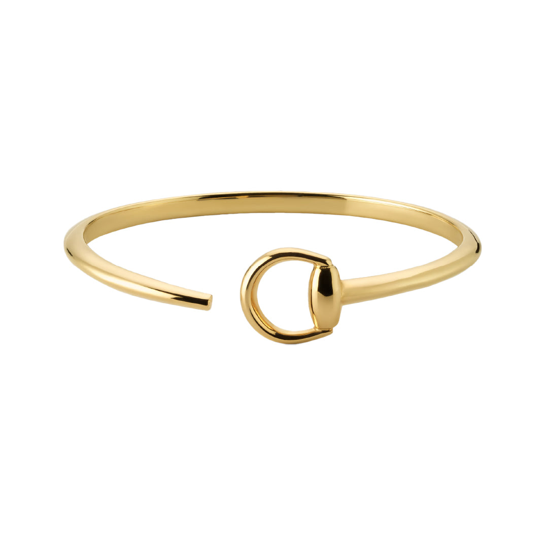 The Gucci Horsebit 18K Yellow Gold Cuff by GUCCI Fine Jewellery features a minimalist open design with a signature central horsebit detail, shown against a plain white background.
