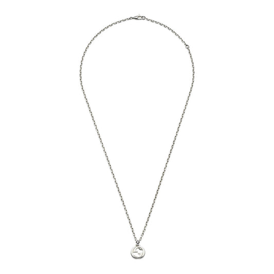 The Gucci Interlocking G Sterling Silver Necklace Pendant by GUCCI Fine Jewellery features a 925 sterling silver chain and a central circular pendant with the Interlocking G motif, offering minimalist elegance. The thin chain ends with a small clasp, embodying understated sophistication.