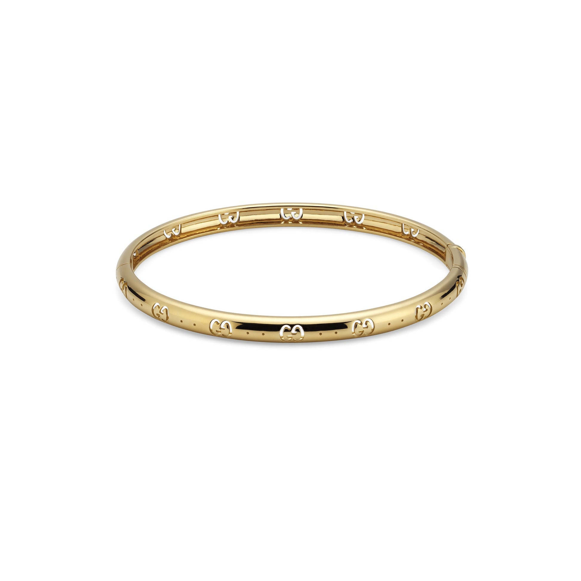 The Gucci Icon 18K Yellow Gold GG Bangle from GUCCI Fine Jewellery highlights the brand's signature style with a sleek, polished finish and an embossed GG cut-out motif that repeats around its circumference.