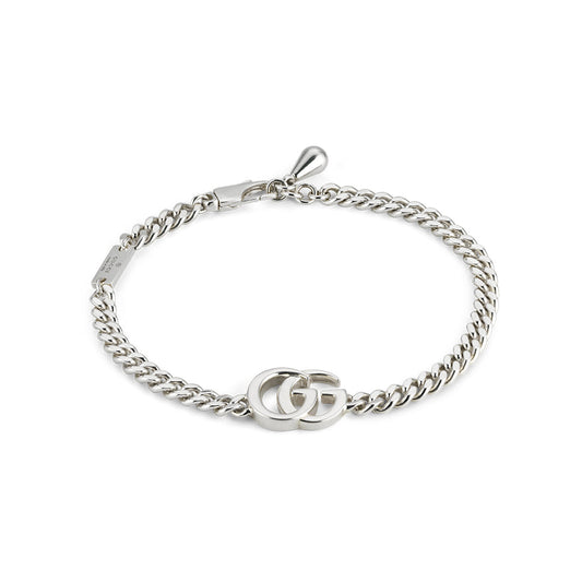 The Gucci GG Marmont Sterling Silver Chain Bracelet by GUCCI Fine Jewellery features an interlocking GG logo and a lobster clasp closure.