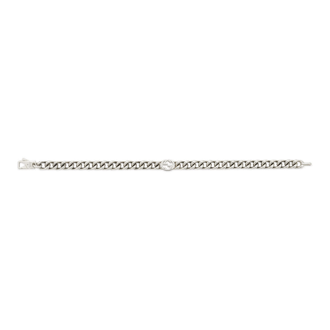 The Gucci Interlocking G Sterling Silver Bracelet by GUCCI Fine Jewellery features chunky curb links and a small round Interlocking G charm—a timeless accessory.