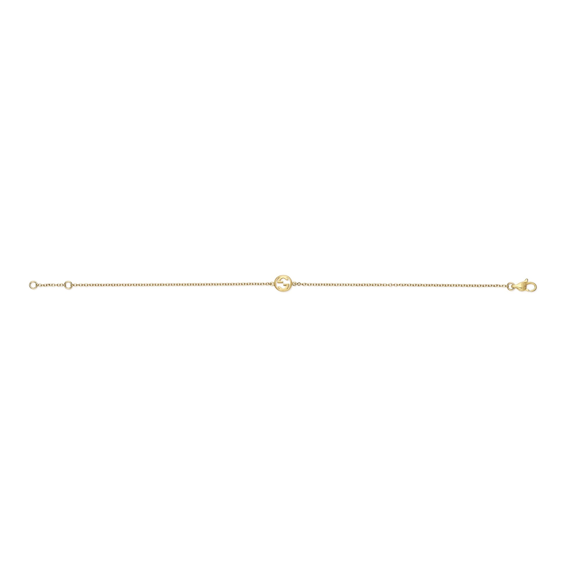 The GUCCI Fine Jewellery Interlocking 18K yellow gold chain bracelet features a small circular charm at the center and a clasp closure, shown on a white background.