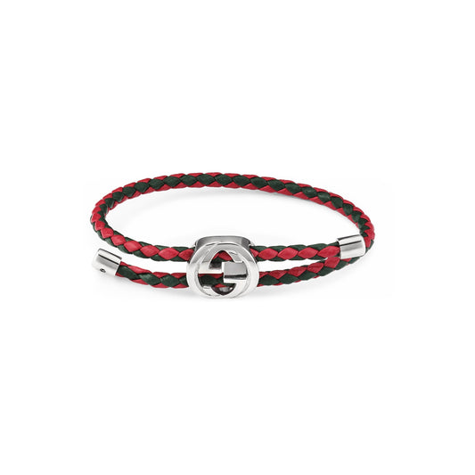 The Gucci Web Braided Leather and Sterling Silver Bracelet by GUCCI Fine Jewellery features red and green braided leather, a silver clasp, and a signature interlocking G logo for a bold statement.