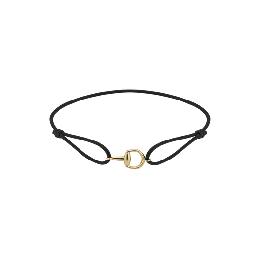 The Gucci Horsebit Cotton Cord with 18K Yellow Gold Bracelet by GUCCI Fine Jewellery features a minimalist black cord with adjustable knots and a small 18k yellow gold D-shaped clasp, shown on a plain white background.
