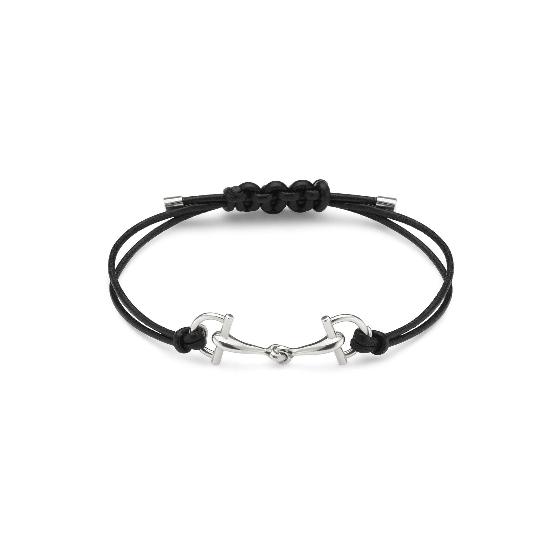 The Gucci Staffa Leather and Sterling Silver Bracelet by GUCCI Fine Jewellery features a minimalist black adjustable cord with a sterling silver horse bit-shaped centerpiece and metal end caps, inspired by classic stirrup motifs.