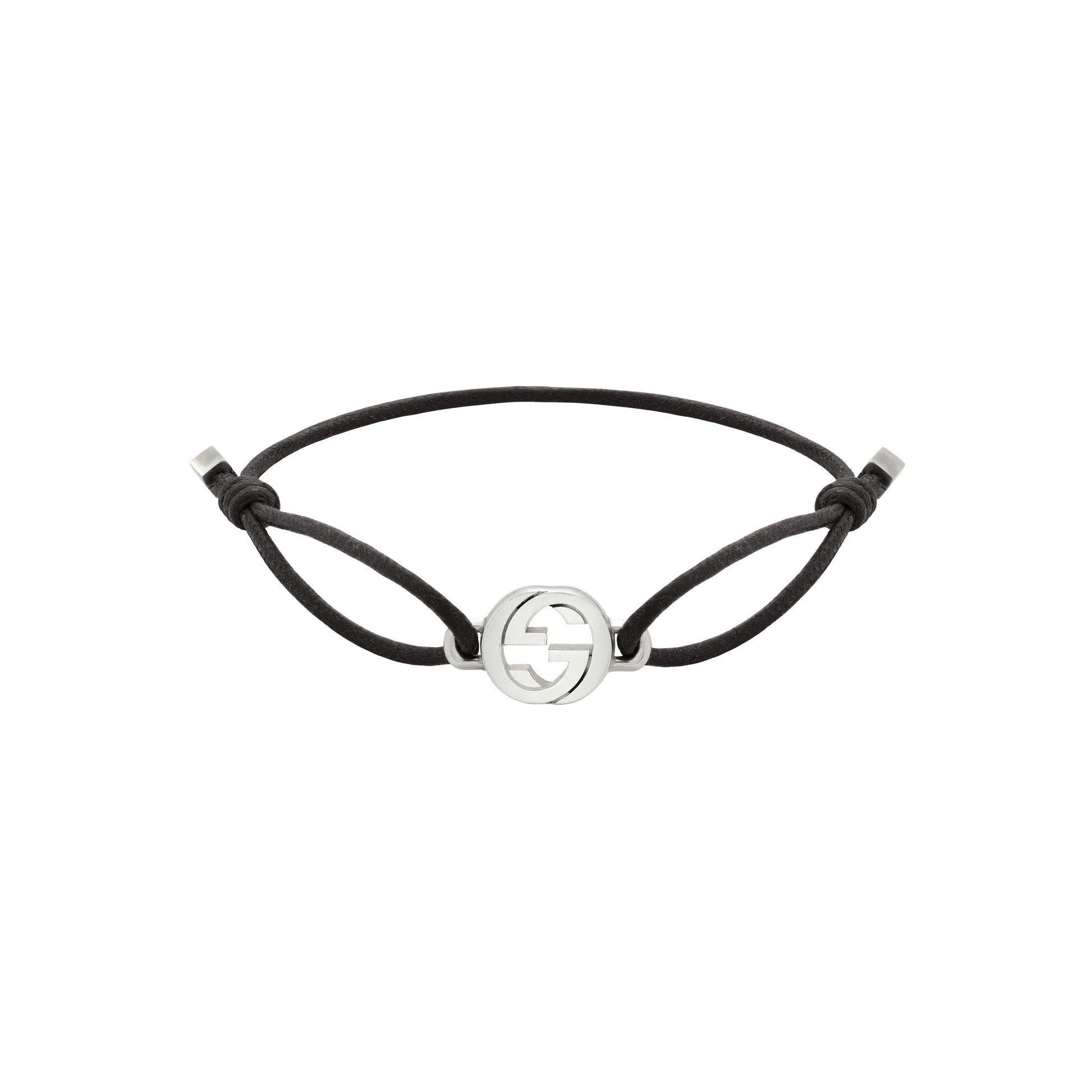 The Gucci Interlocking Cotton Cord with Sterling Silver Bracelet by GUCCI Fine Jewellery features a minimalist black cord, an interlocking G sterling silver emblem, adjustable knotted closure, and elegant silver end caps.