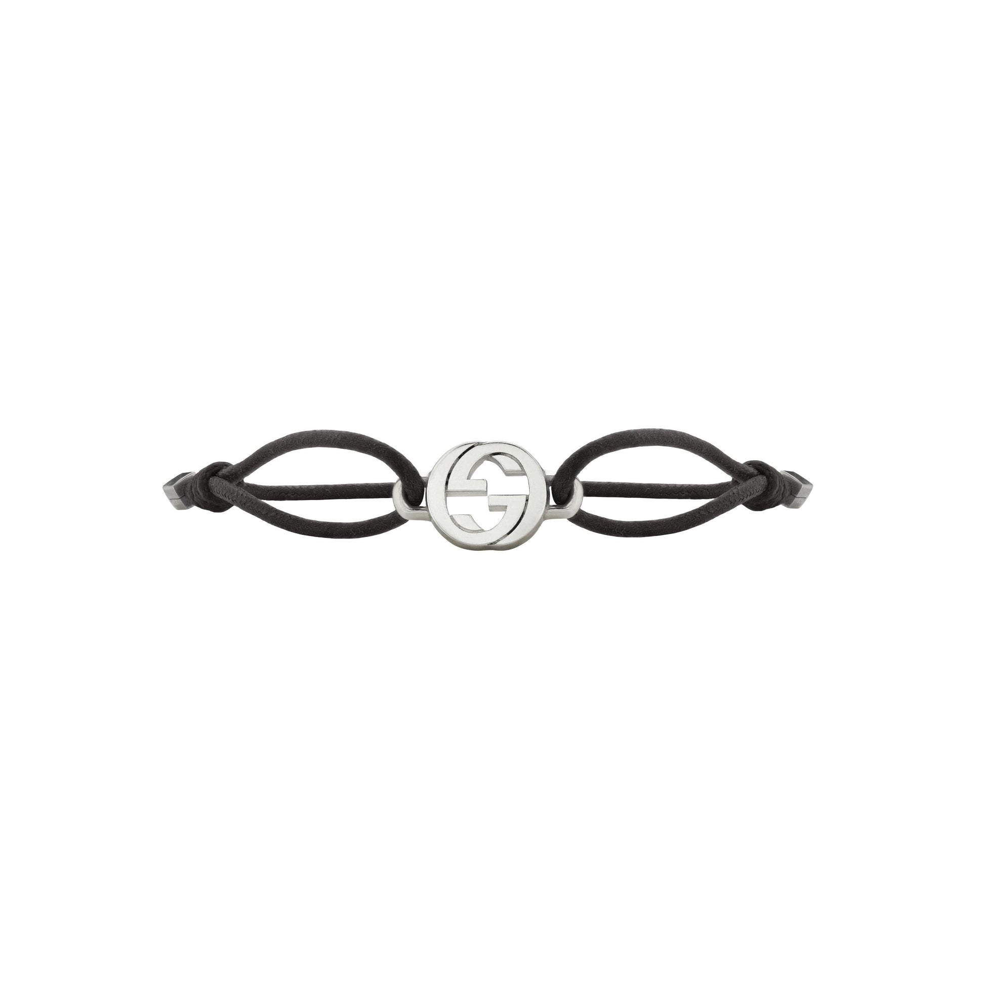 The Gucci Interlocking Cotton Cord with Sterling Silver Bracelet by GUCCI Fine Jewellery features a black cord, central sterling silver Interlocking G emblem, and adjustable knots for sizing.