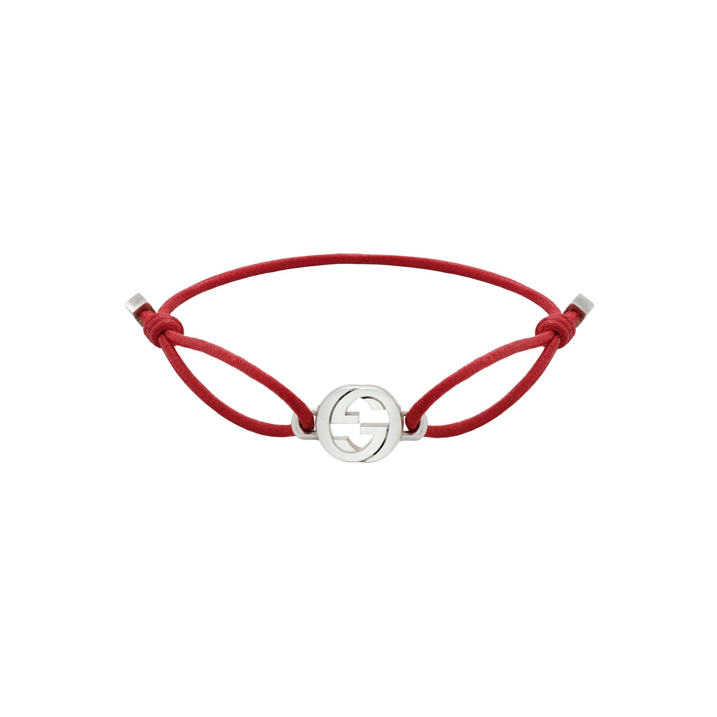 The Gucci Interlocking Cotton Cord with Sterling Silver Bracelet by GUCCI Fine Jewellery features a red cord and a silver-toned circular charm with the iconic Interlocking G logo, plus adjustable side knots for a perfect fit.