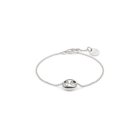 Gucci Marina Sterling Silver Chain Bracelet in sterling silver, featuring a central anchor-shaped link with Gucci script engraving and a small circular charm at the clasp.