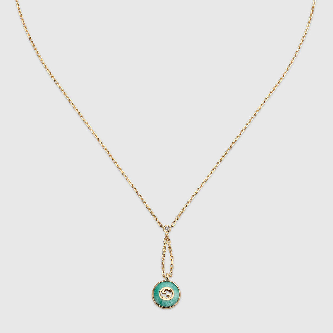 The Gucci Interlocking 18K Yellow Gold Diamond Necklace Pendant with Amazonite by GUCCI Fine Jewellery features a small round amazonite stone and GG logo, shown on a plain white background.
