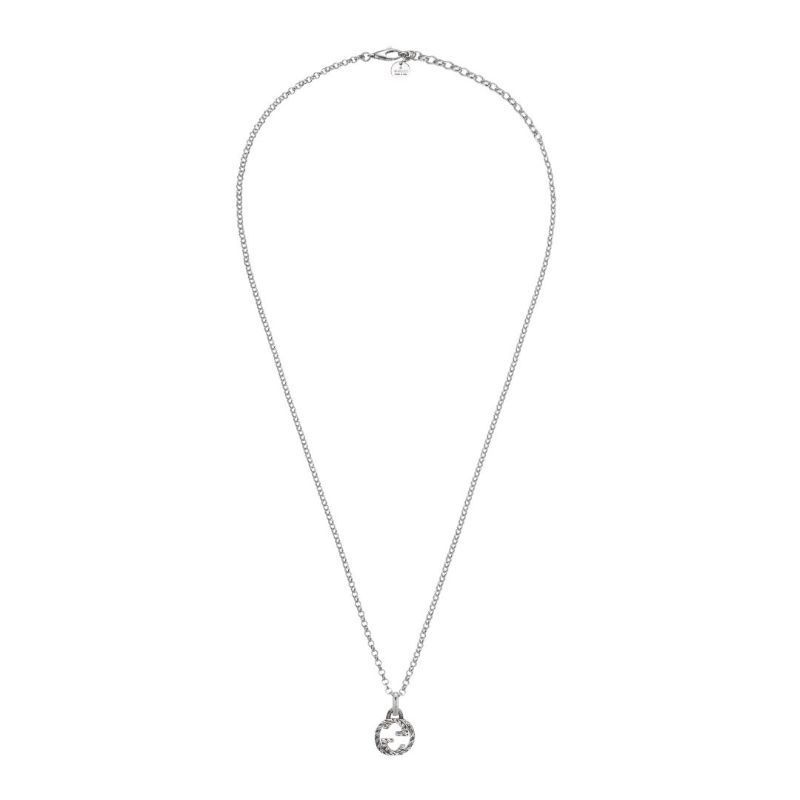 A necklace from GUCCI Fine Jewellery showcasing a delicate aged sterling silver chain and the iconic Gucci Interlocking G pendant, elegantly presented on a white background.