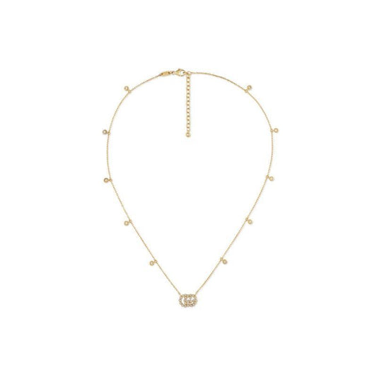 This exquisite Gucci GG Running necklace, crafted from 18K Yellow Gold by GUCCI Fine Jewellery, showcases small round beads and an interlocking circular pendant at the center. Adorned with sparkling diamonds, this elegant piece exudes sophistication, making it a timeless addition to any jewelry collection.
