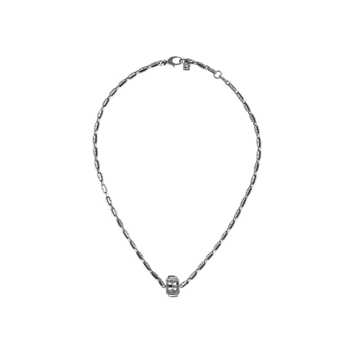 Introducing the Gucci G Cube Sterling Silver Necklace from GUCCI Fine Jewellery. This exquisite piece features a sophisticated design with a small cube pendant in the center, showcasing intricate detailing and understated crystals. The necklace includes a clasp at the top and is perfect for everyday elegance, set against a plain white background.