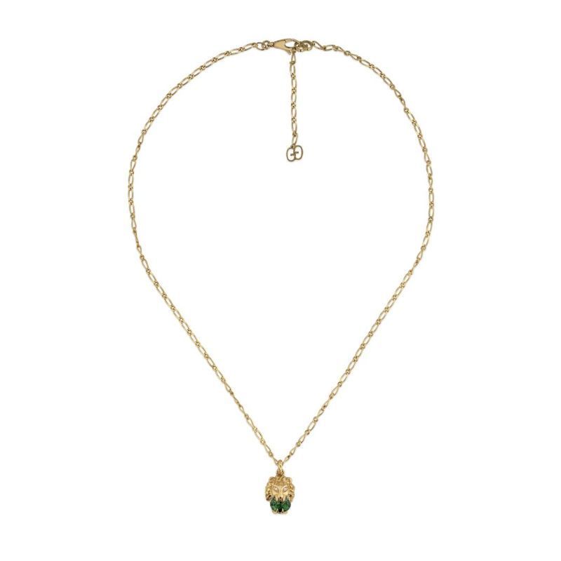 The Gucci Lionhead 18K Yellow Gold Chromodiopside and Diamond Necklace Pendant from GUCCI Fine Jewellery features a gold chain link design with a lion head pendant, adorned with green chromodiopside gem accents at the base, exuding elegance.