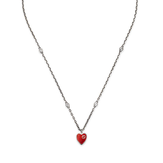 Discover the GUCCI Fine Jewellery piece: the Gucci Interlocking G Sterling Steel Necklace, showcasing a red enamel heart pendant enhanced with small crystal-like accents along the chain.